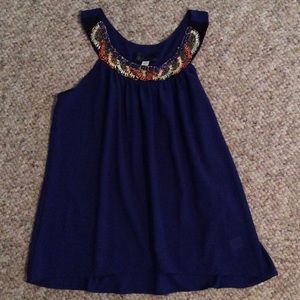 Blue top with beaded neckline.