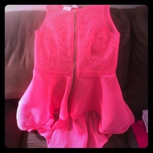 Hot pink mesh peplum high/low top.