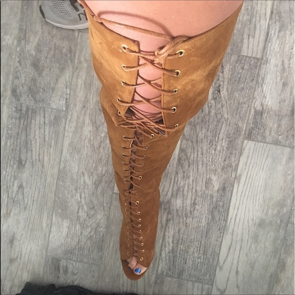 Thigh high lace up boot