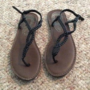 Black strappy sandals.