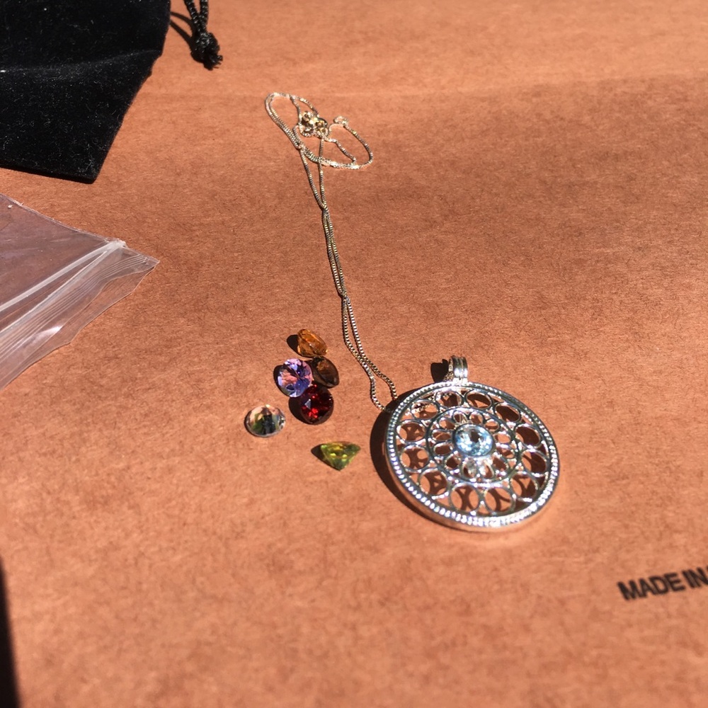 Silver pendant necklace with replaceable gems