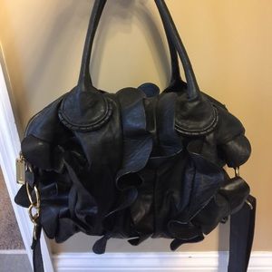 Black Steve Madden ruffle purse.