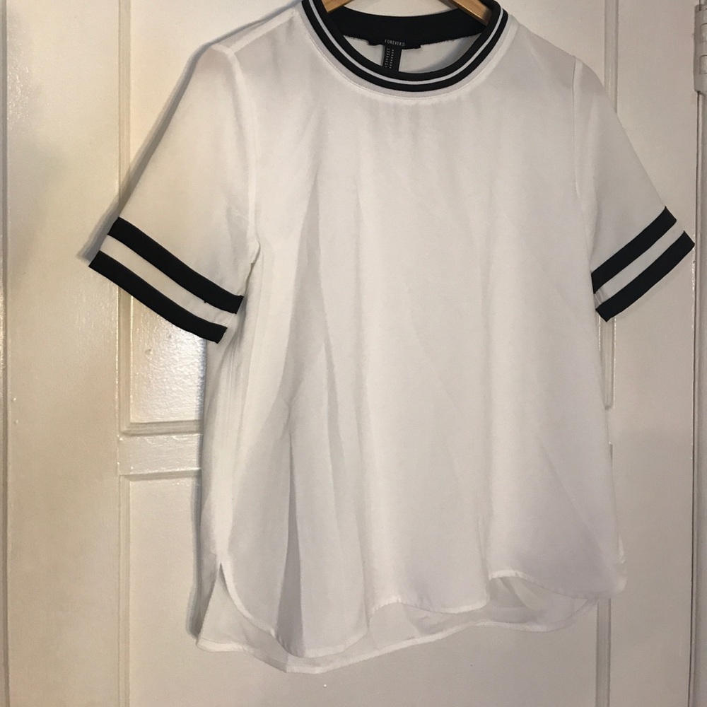 White oversized top with black detail