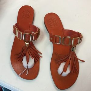 Orange Tory Burch tassel sandal
