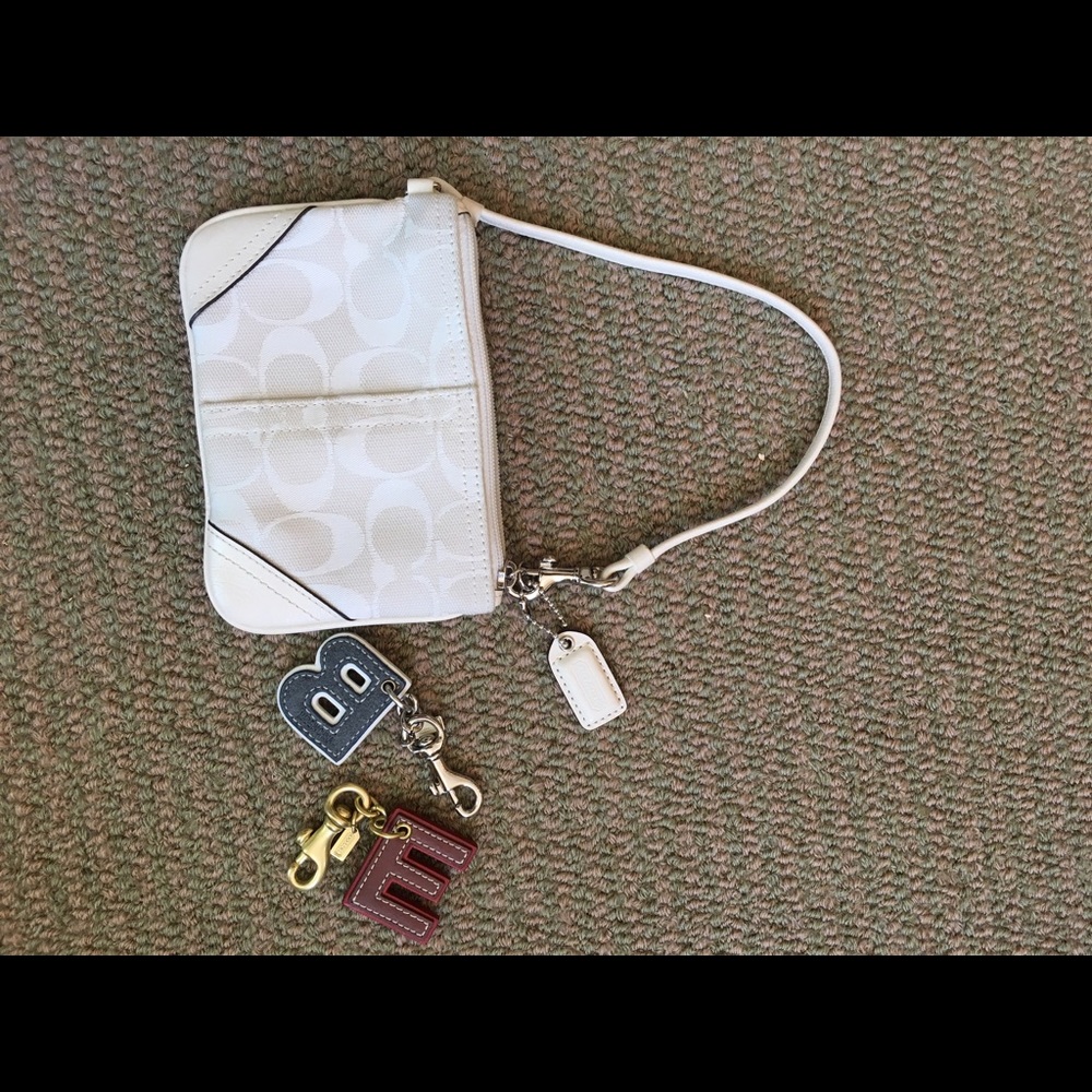 Coach wristlet with E and B letter keychains