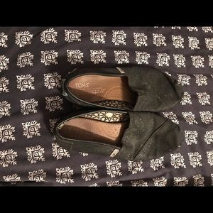 Black sparkly toms. Signs of wear
