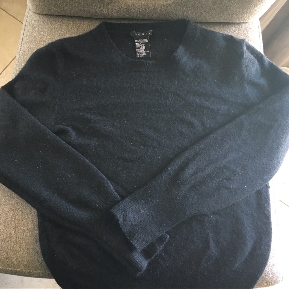 Sweater, states medium, runs smaller