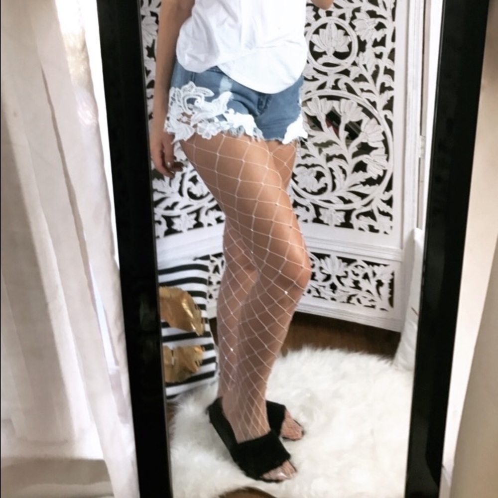 Distressed denim shorts with crochet detail