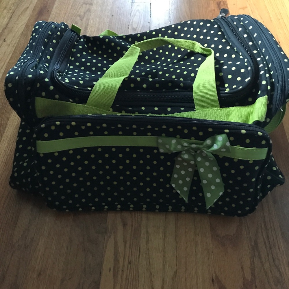 black and greet polk a dot duffel bag