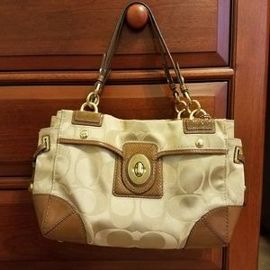 Authentic Coach handbag with coral lining.