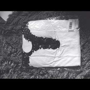 Tight white dress with black lace