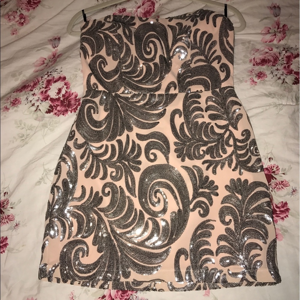 Pink sequin strapless dress.