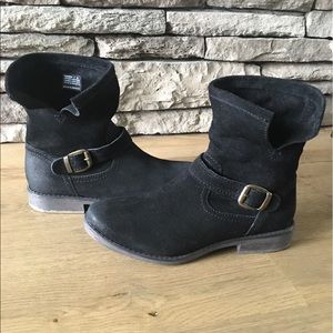 Black suede boots with side buckle