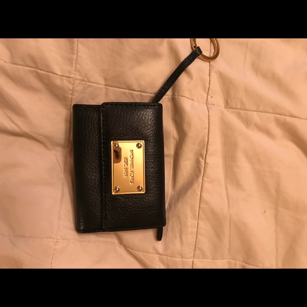 Black Michael Kors wallet.