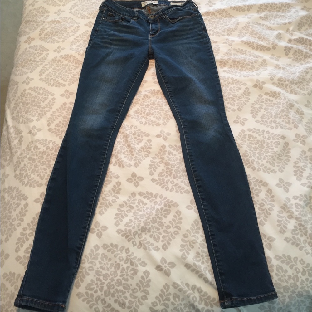 Skinny, dark washed jeans