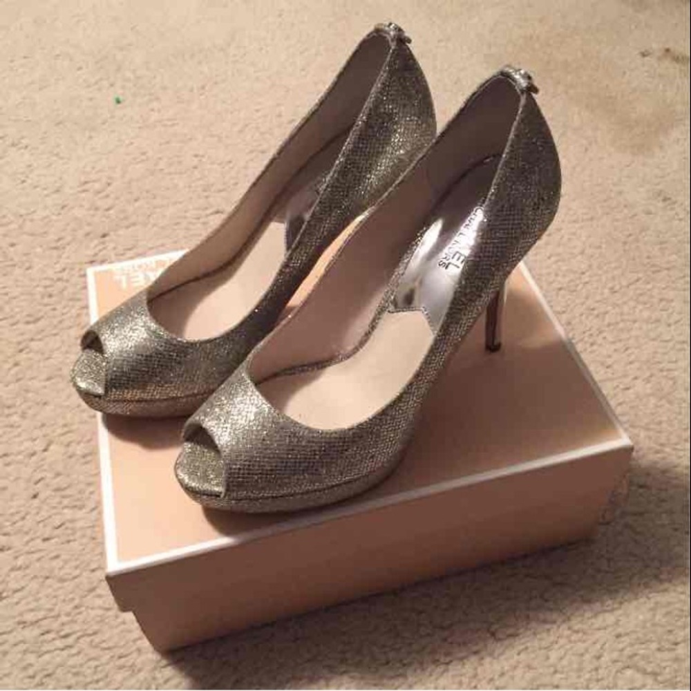 Brand new silver MK pumps