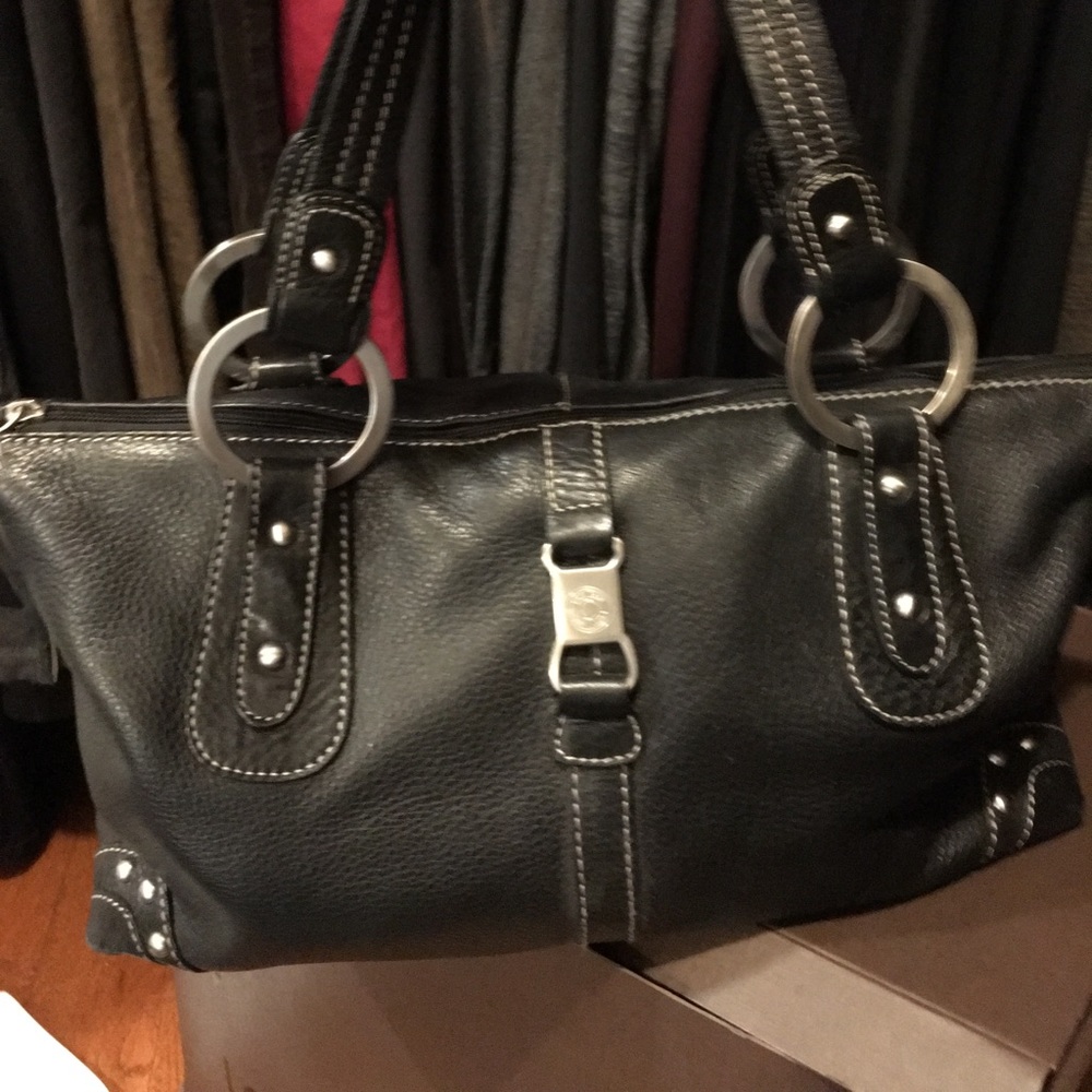 Black leather shoulder bag. The Sak pink label
