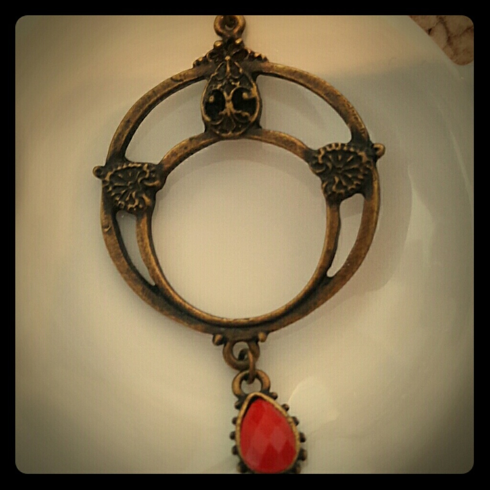 Gold earrings (with red bead accent)