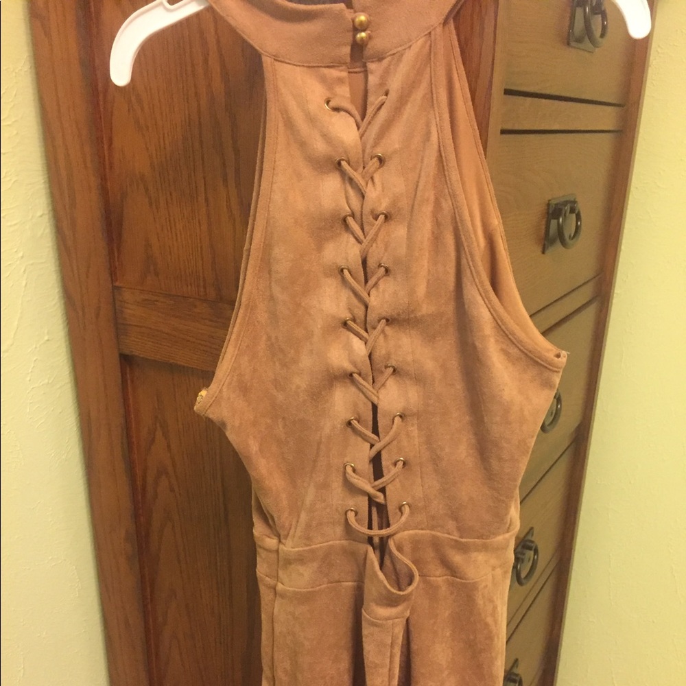 Tan suede romper with lace up back