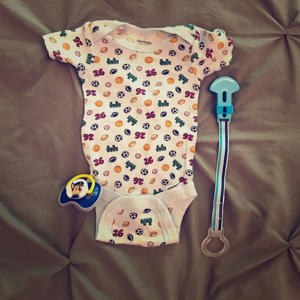 Onesie, Paw patrol pacifier and pacifier holder.