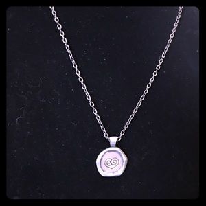 Silver necklace with two sided pendant