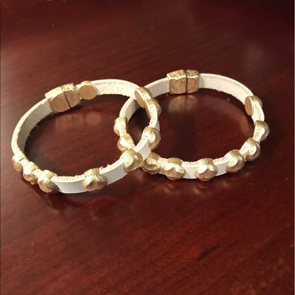 Gold and white bracelets bought for $150.