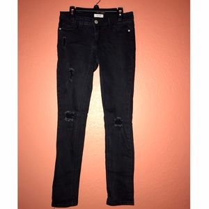 Wet Seal black distressed skinny jeans.