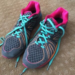 New Balance. Base color is gray with multi color.