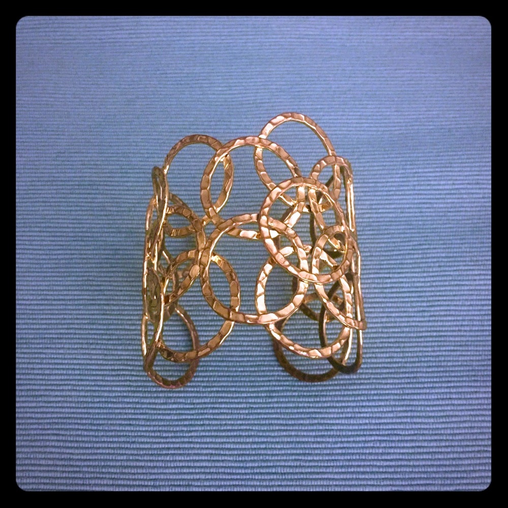 Gold tone hammered cuff bracelet