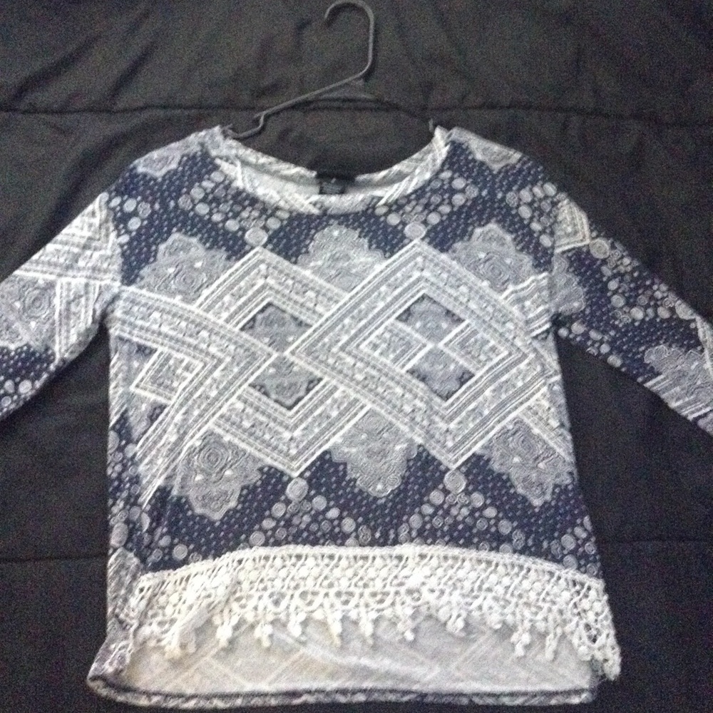 A  long sleeve women's shirt. Is kinda a crop top