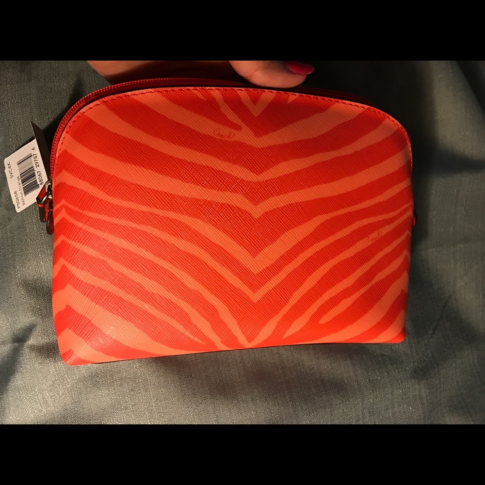 New with tags coach cosmetic bag, zebra print