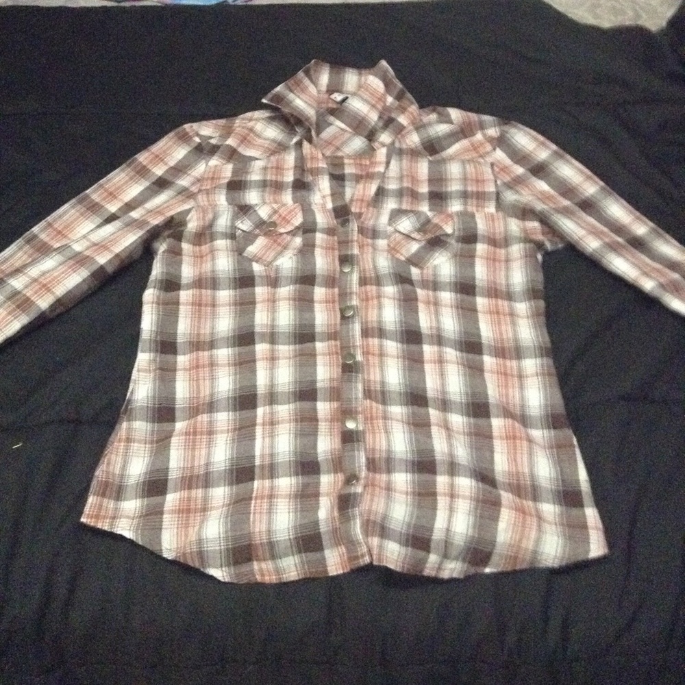 Pink plaid button up shirt.