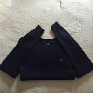 Polo sweater.