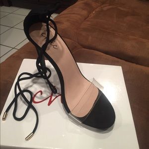 Black strappy heels. Brand new. Clear strap. US 8