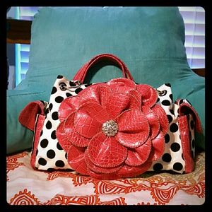 White and black polka dot purse with rose accents