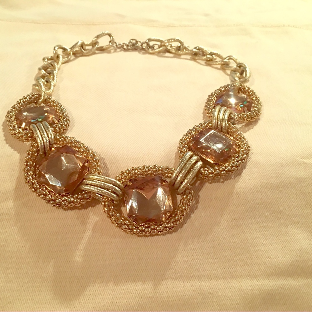 Beautiful gold loop necklace w/amber color stones.