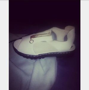 Women zipping up sandals