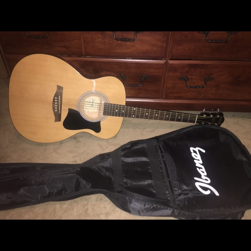Ibanez acoustic guitar and it's case.