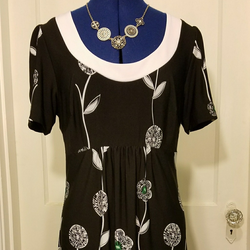 Knee length black dress with white flowers