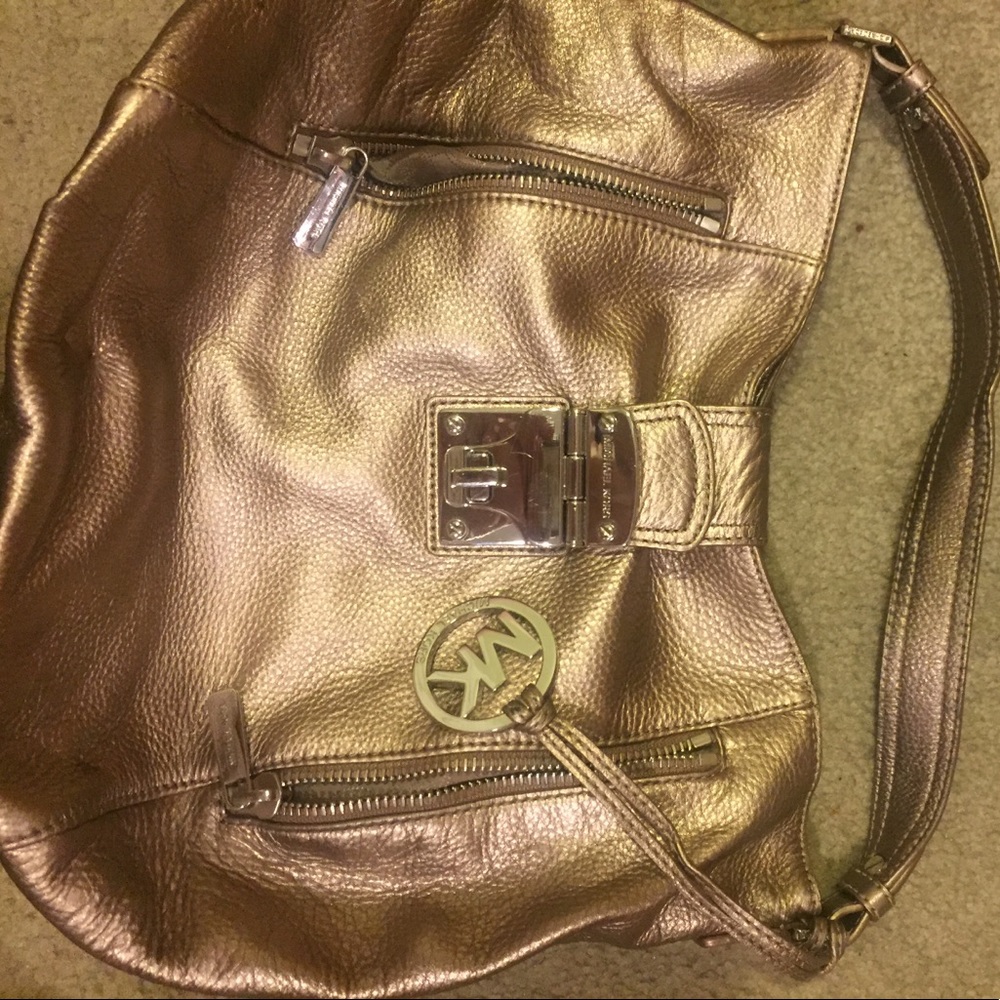 Michael Kors gold pocket book