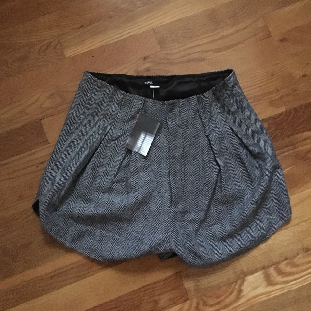 Black and white tweed paper bag shorts.