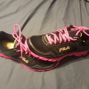 Pink and black fila running shoes