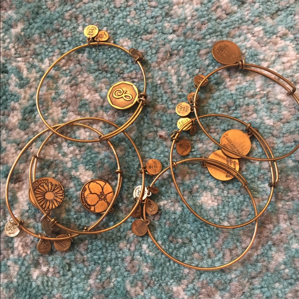 Six gold Alex + Ani bracelets!