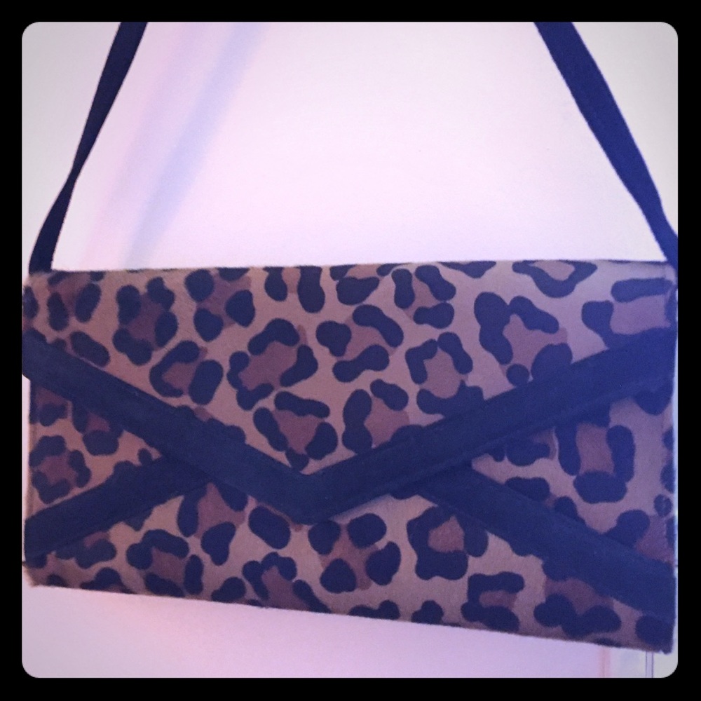 Cheetah print leather clutch.