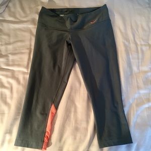 Gray Nike leggings with pink and orange detail