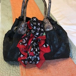 Black "Louis Vuitton" bag.