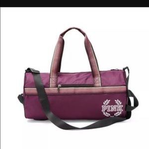PINK maroon duffle bag.