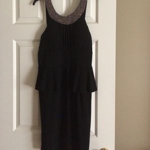 Pretty never worn formal peplum style black dress.