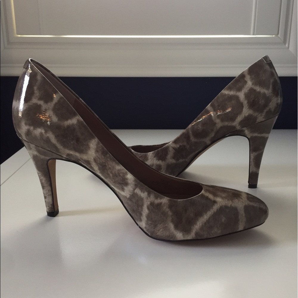Vince Camuto snake print pumps.