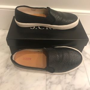 Black snake skin slip on sneakers